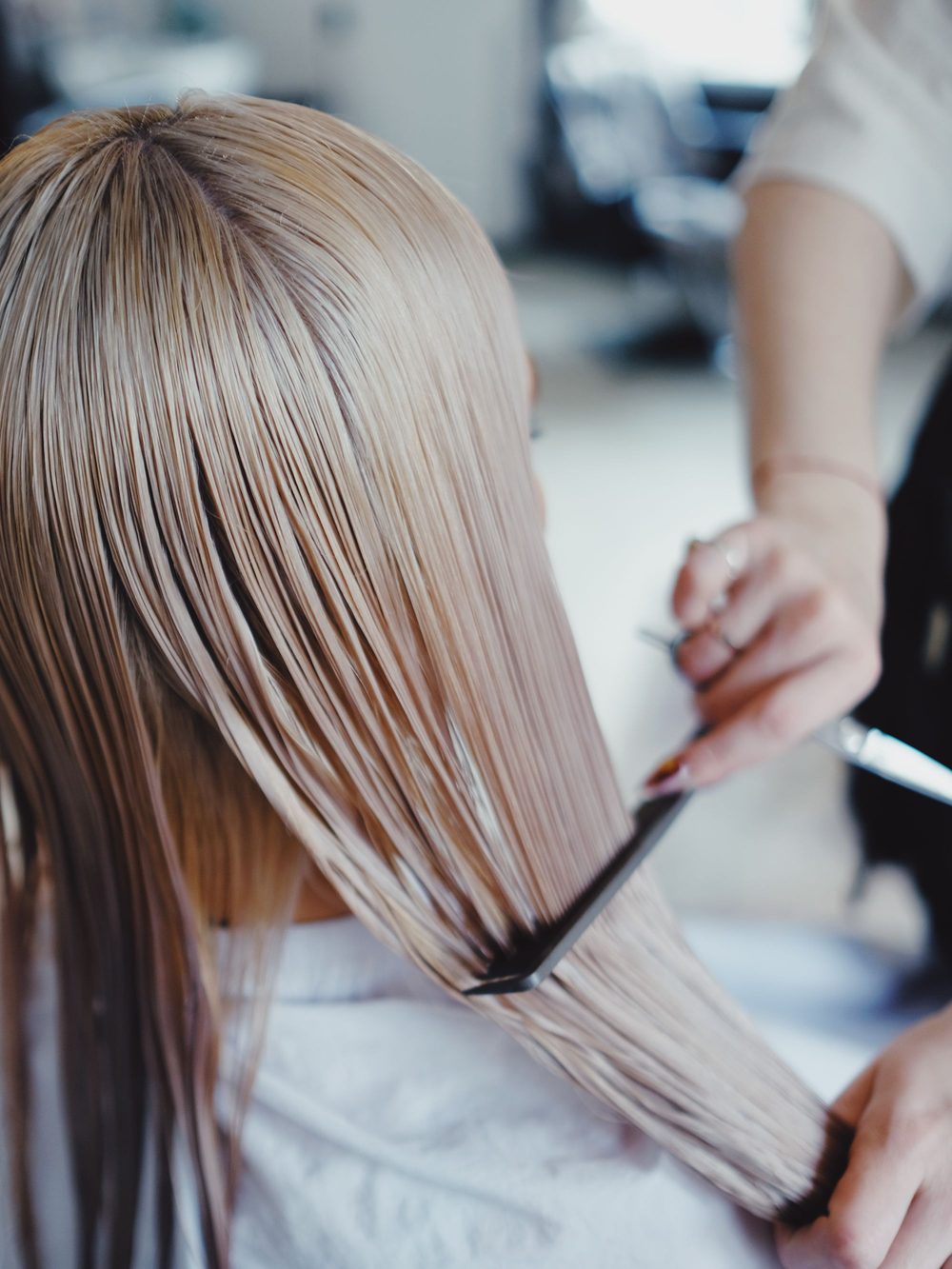 Hair being worked on with a styling tool.